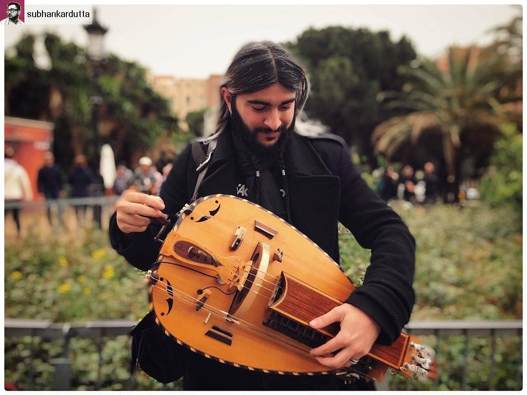 Hurdy-gurdy musician busking in the street